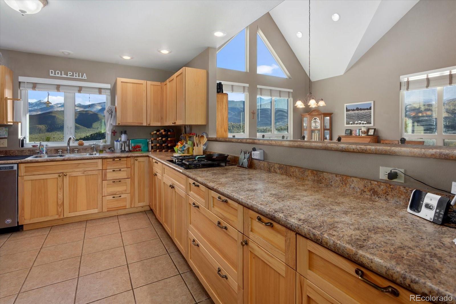 402 Trailridge Road Coaldale, CO 81222 - Photo 13 of 50 a large kitchen with a sink and cabinets