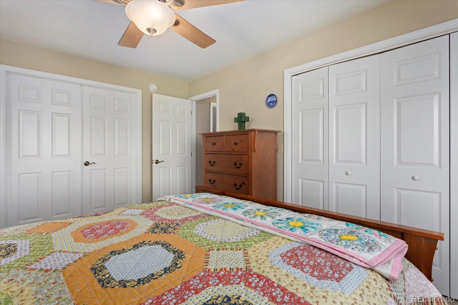 402 Trailridge Road Coaldale, CO 81222 - Photo 27 of 50 a bedroom with a bed and a dresser in it