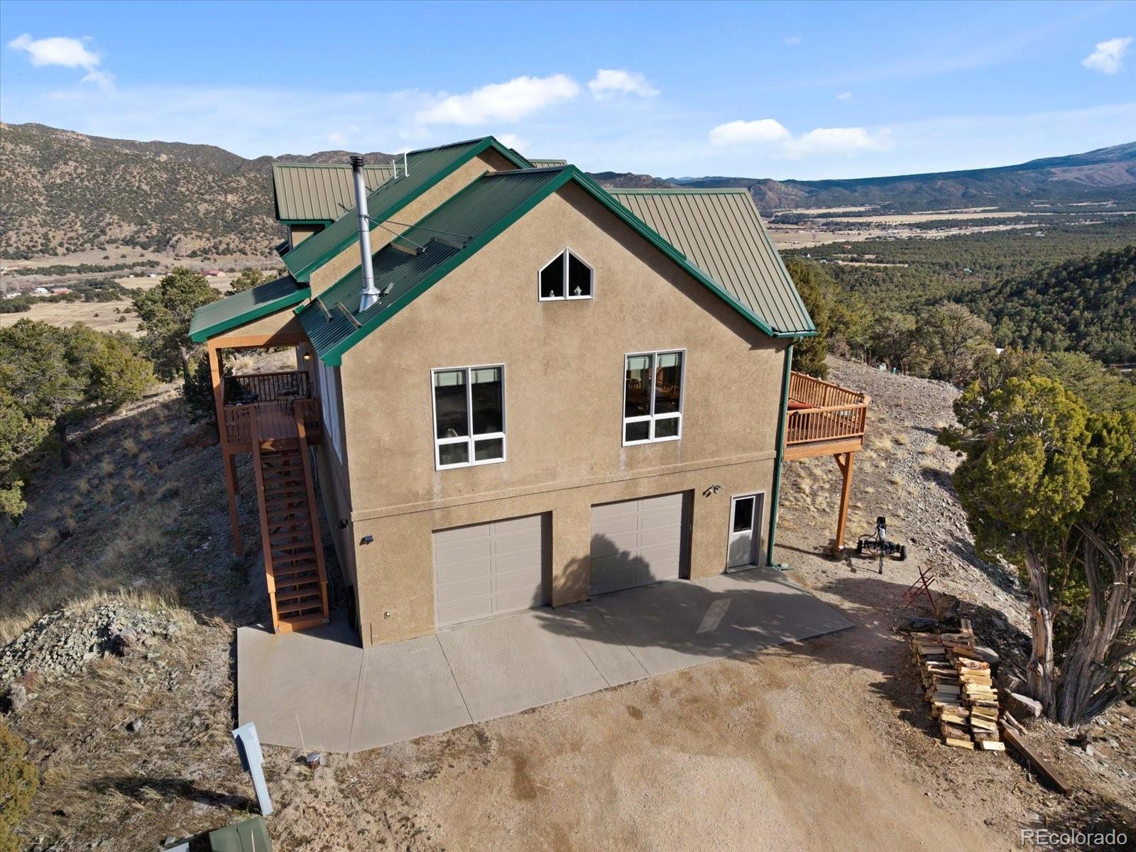 402 Trailridge Road Coaldale, CO 81222 - Photo 35 of 50 a view of a house with a yard