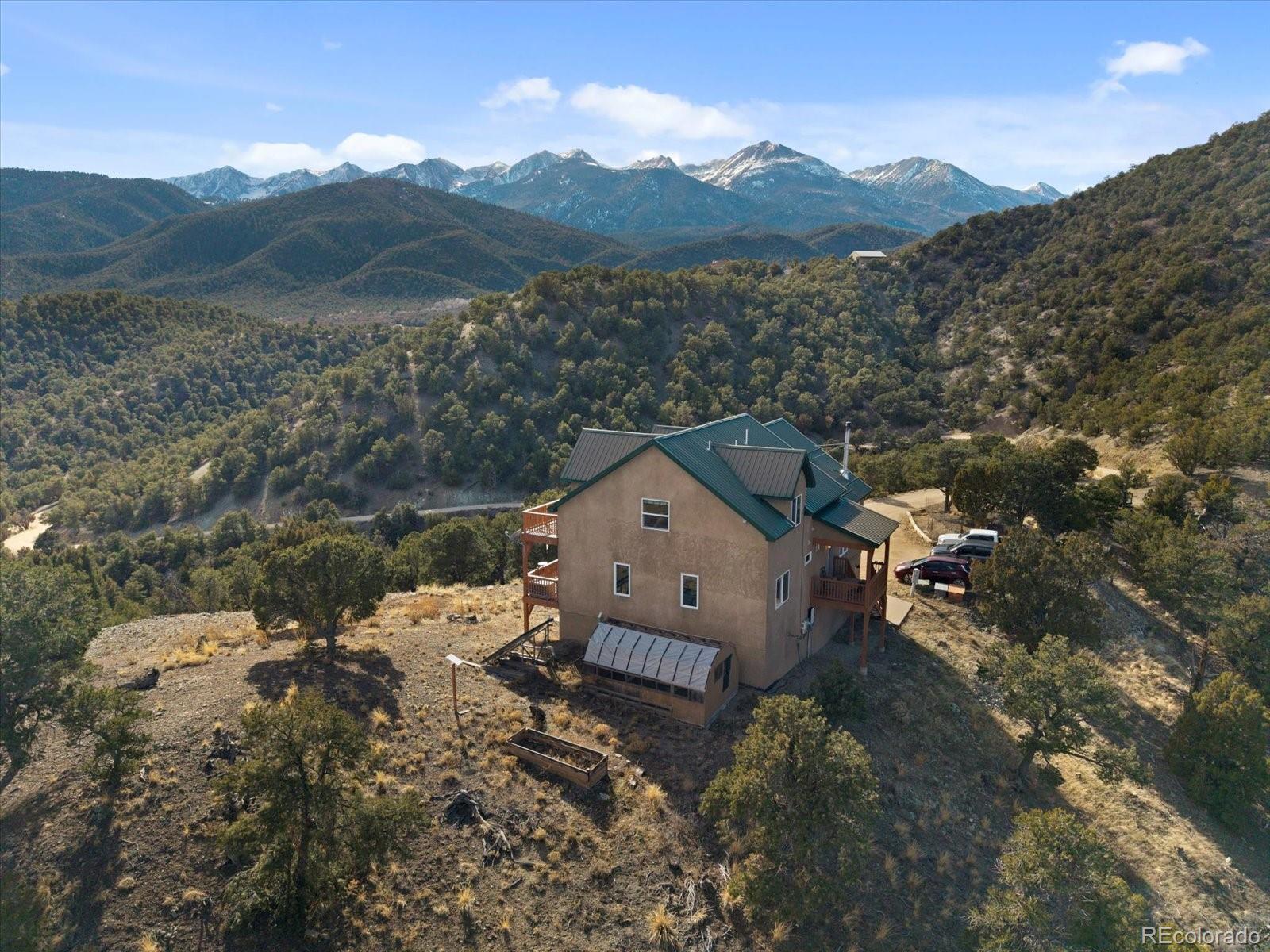 402 Trailridge Road Coaldale, CO 81222 - Photo 41 of 50 a view of a house with a mountain and a forest view