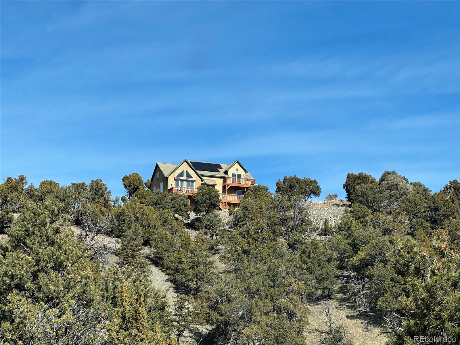 402 Trailridge Road Coaldale, CO 81222 - Photo 45 of 50 a view of a lake in middle of a field