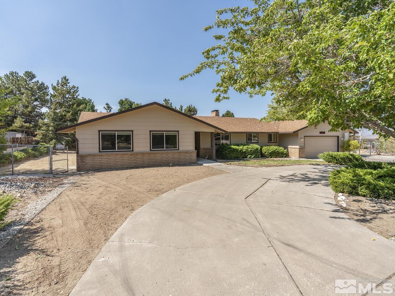 14015 Minnetonka Circle Reno, NV 89521 - Photo 1 of 22 a front view of a house with a yard