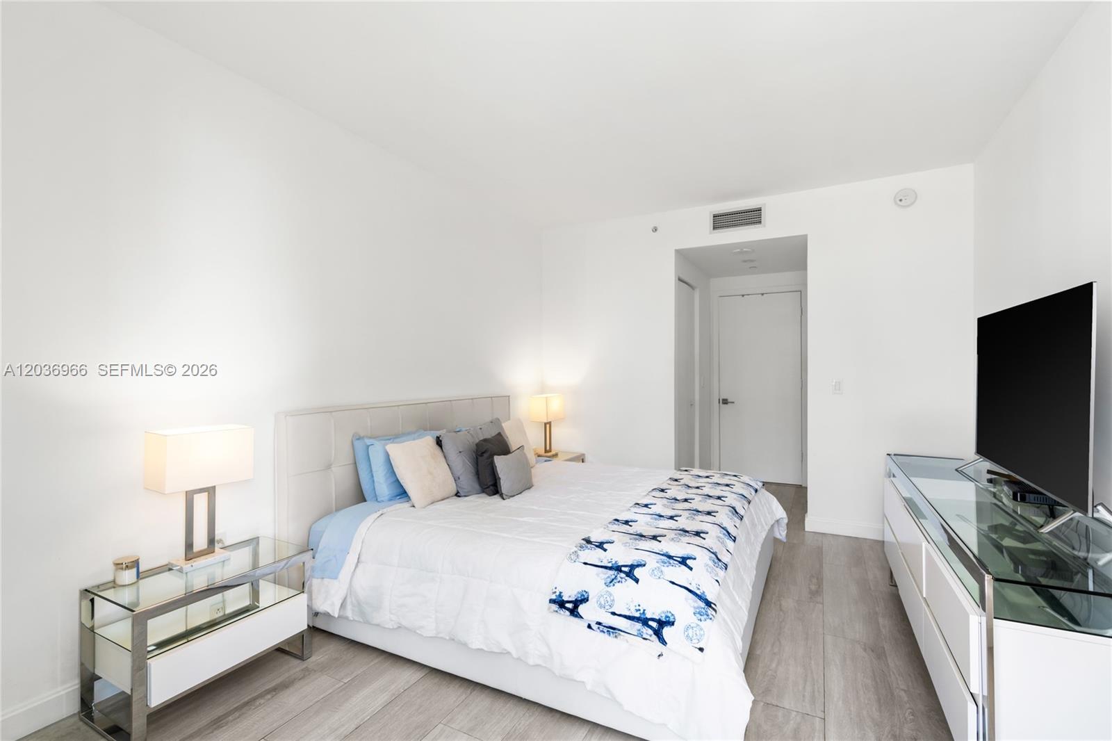 55 Southwest 9th Street, Unit 1904 Miami, FL 33130 - Photo 37 of 66 a bedroom with a bed and a flat screen tv