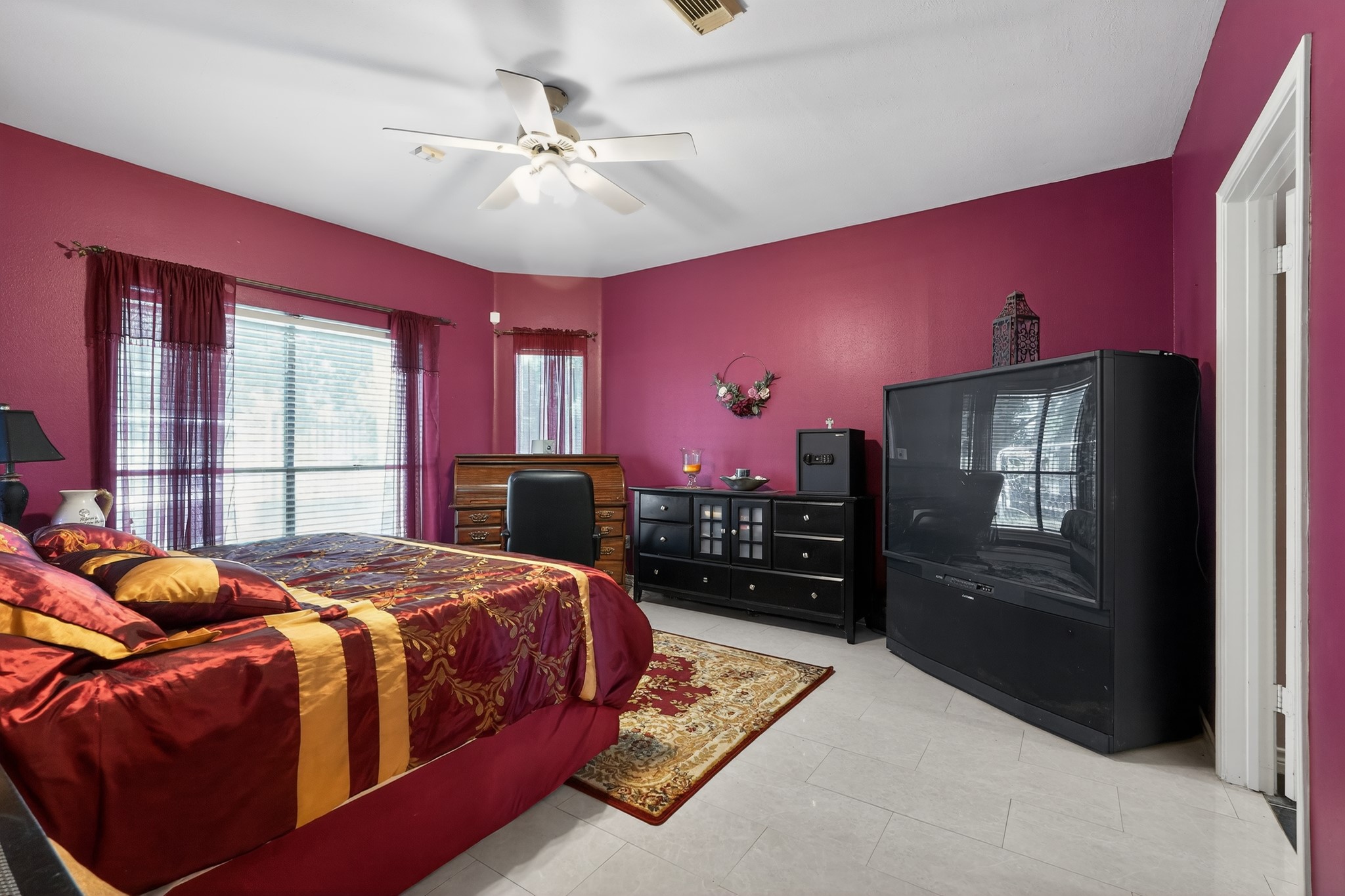 19027 Relay Road Humble, TX 77346 - Photo 16 of 29 Spacious primary bedroom with marble floors and natural light.