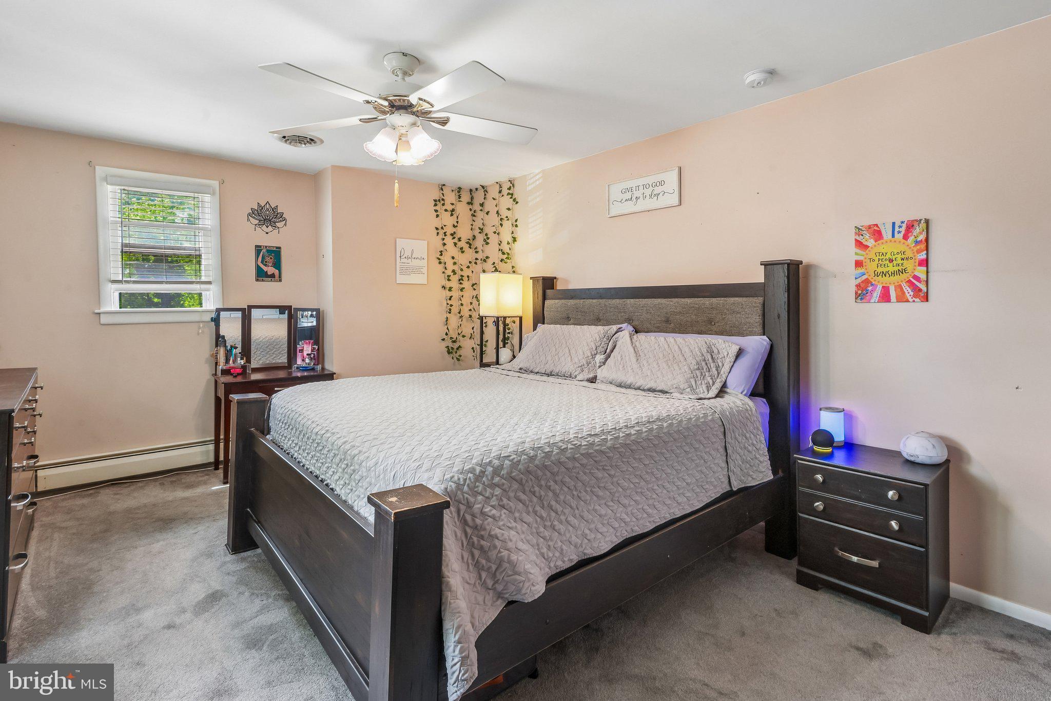 878 Crescent Avenue Runnemede, NJ 08078 - Photo 12 of 24 a spacious bedroom with a bed and a chandelier