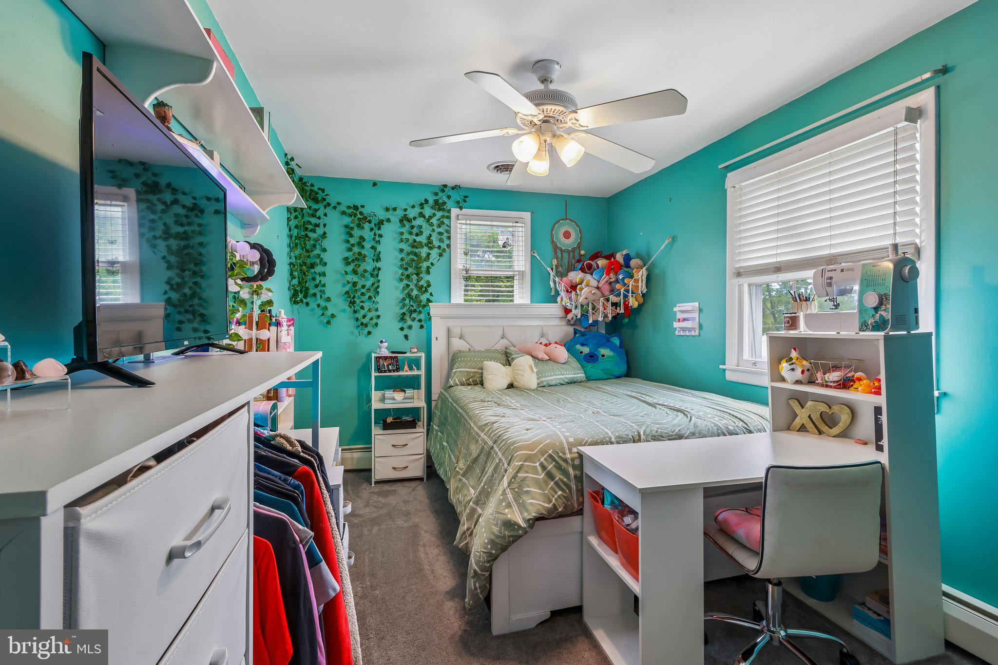 878 Crescent Avenue Runnemede, NJ 08078 - Photo 13 of 24 a bed room with furniture and a chandelier