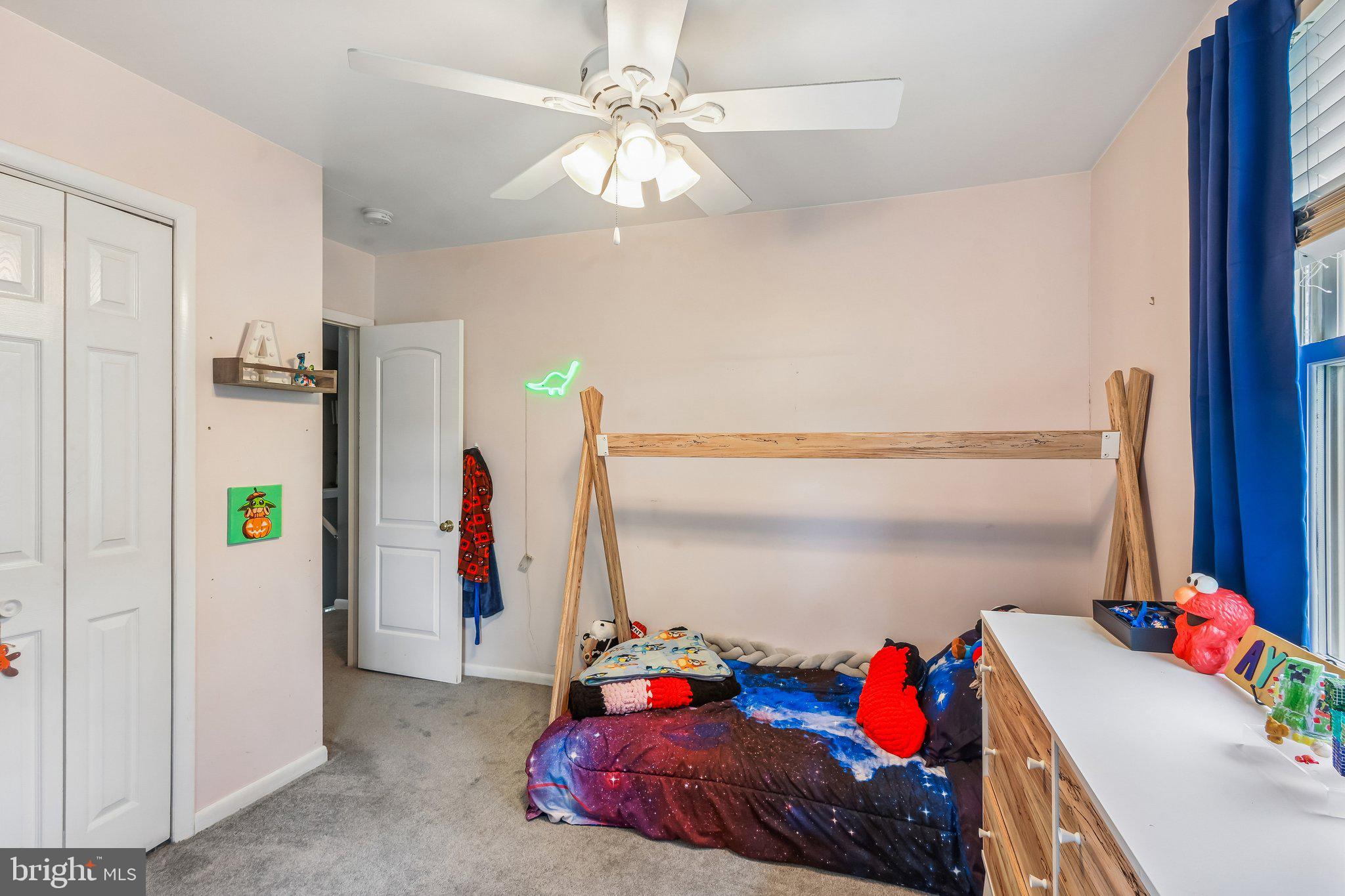 878 Crescent Avenue Runnemede, NJ 08078 - Photo 14 of 24 a bedroom with a bed and a chandelier