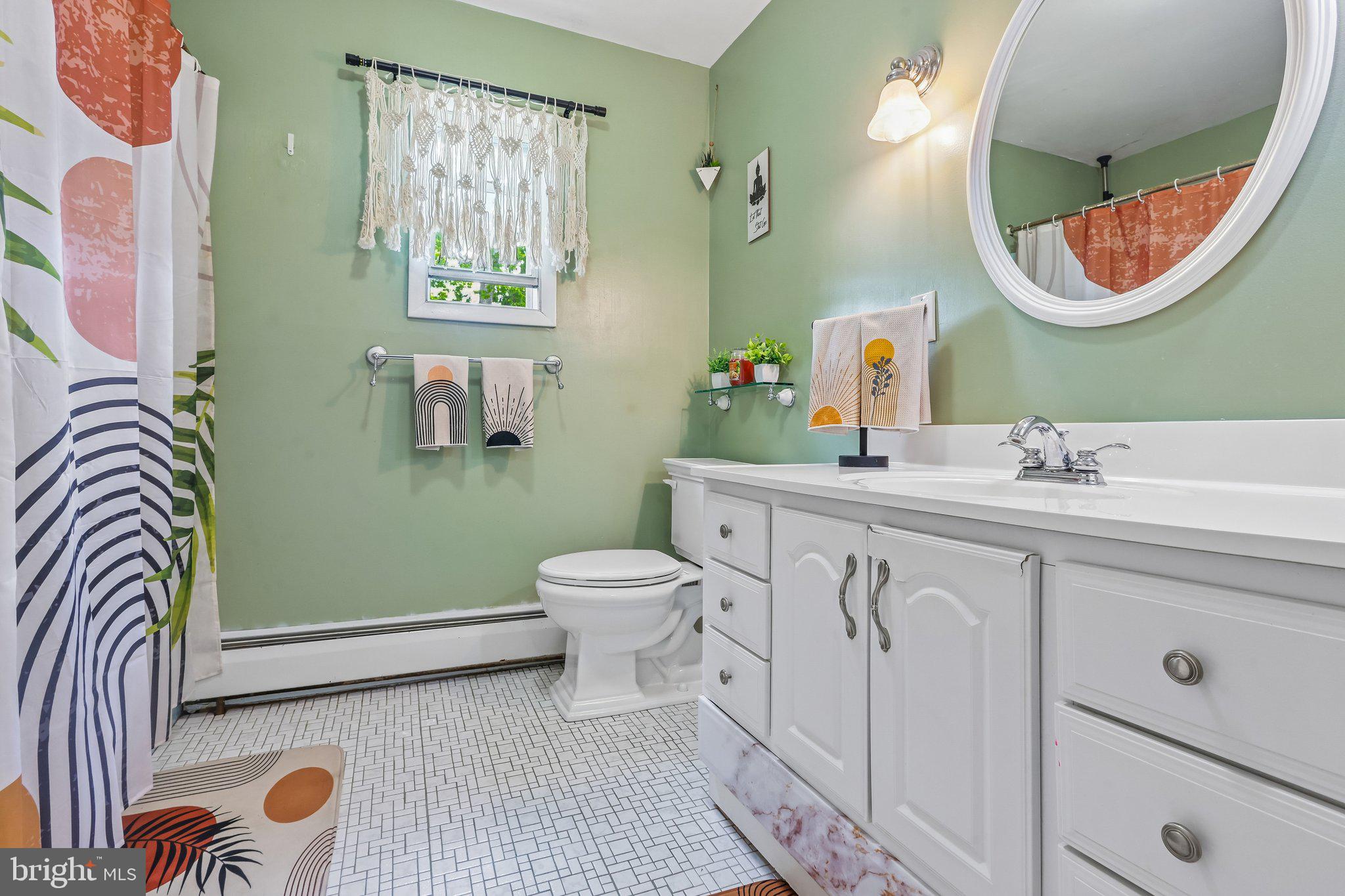 878 Crescent Avenue Runnemede, NJ 08078 - Photo 19 of 24 a spacious bathroom with a mirror a sink and a mirror