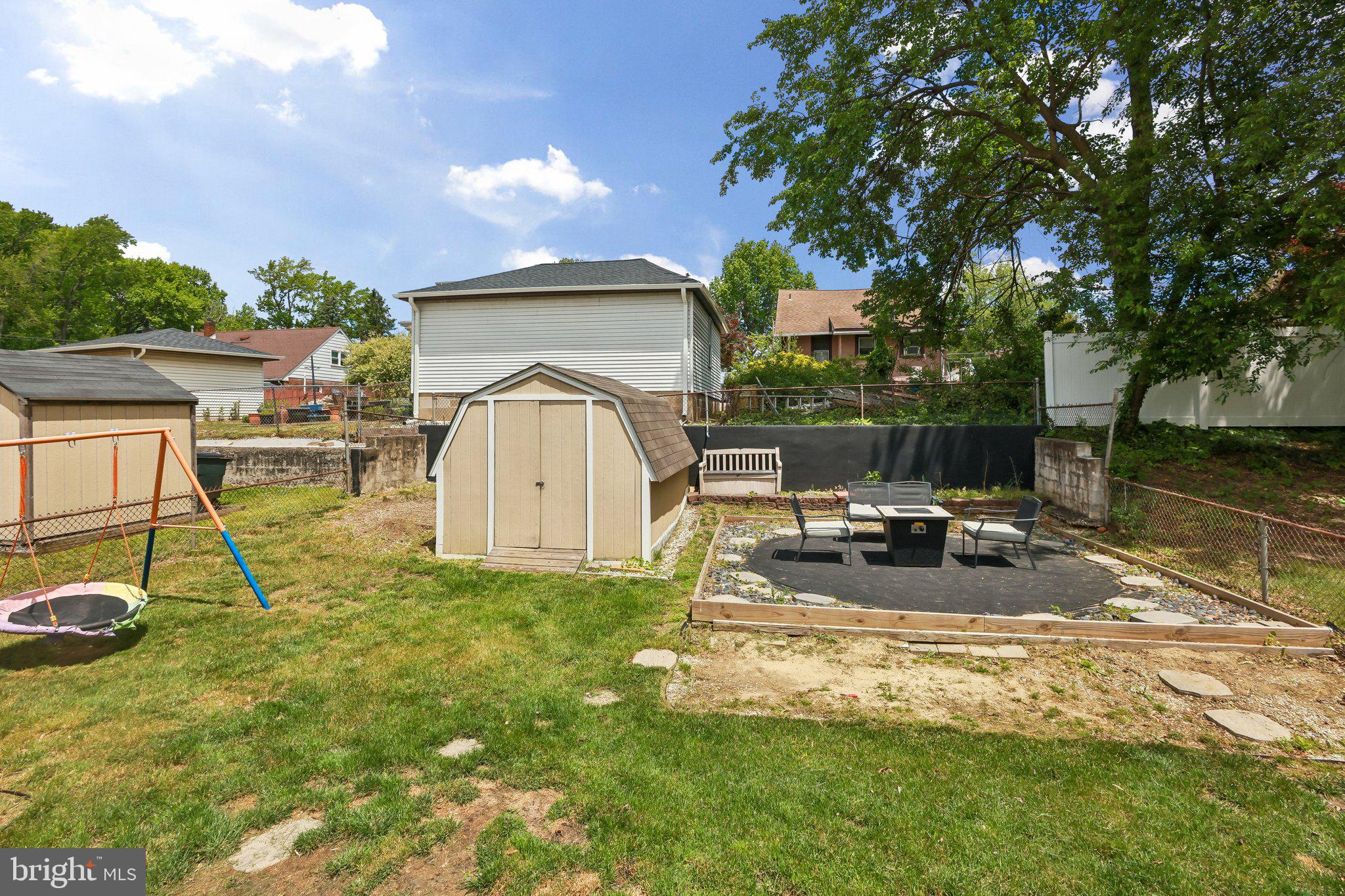 878 Crescent Avenue Runnemede, NJ 08078 - Photo 21 of 24 a view of a white house with a patio and a yard