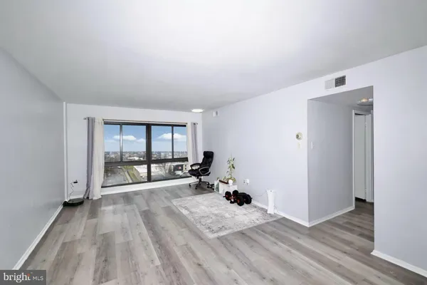 a view of a room with a large window