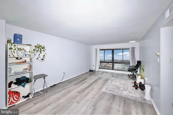 a room with gym equipment and a window