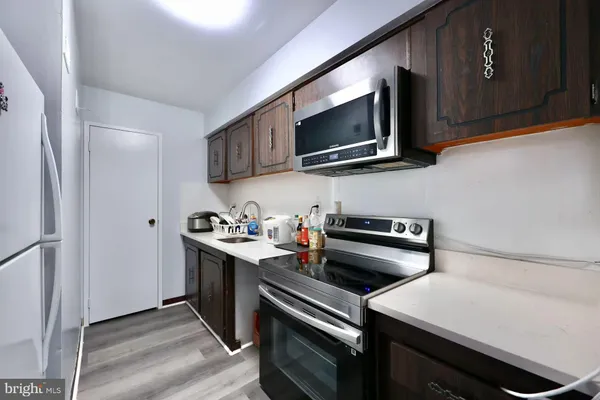 a kitchen with a stove and a microwave