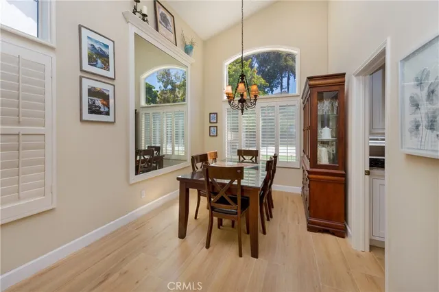 a dining room with furniture and window