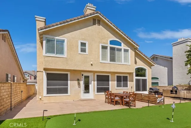 a front view of house with yard and outdoor seating