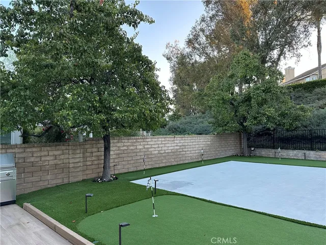 a view of a backyard with large trees