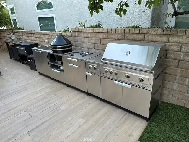 a stove top oven sitting inside of a kitchen