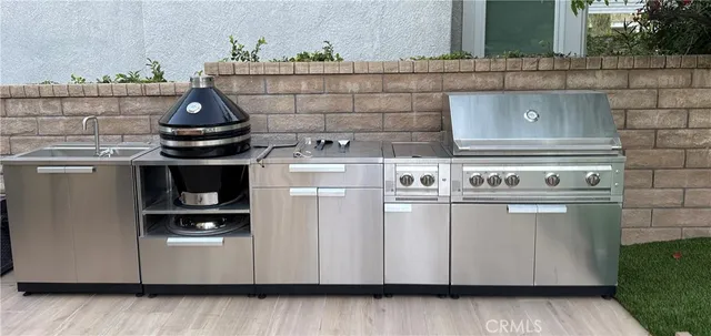 a stove top oven sitting inside of a kitchen