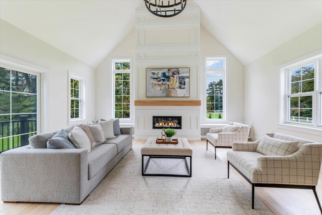 103 Center Street Hanover, MA 02339 - Photo 16 of 42 a living room with furniture a rug and a large window