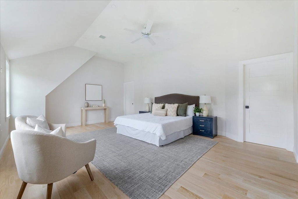 103 Center Street Hanover, MA 02339 - Photo 19 of 42 a bedroom with a bed and a chair