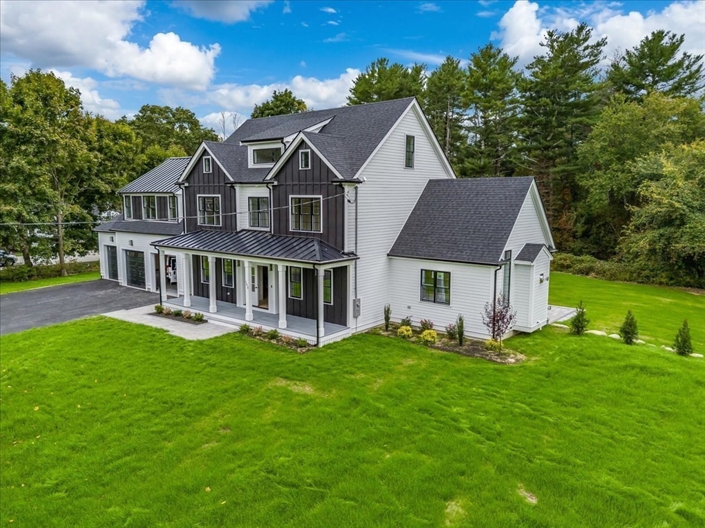 103 Center Street Hanover, MA 02339 - Photo 2 of 42 a aerial view of a house with a yard