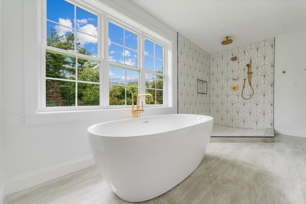 103 Center Street Hanover, MA 02339 - Photo 24 of 42 a bathroom with a bathtub and a shower