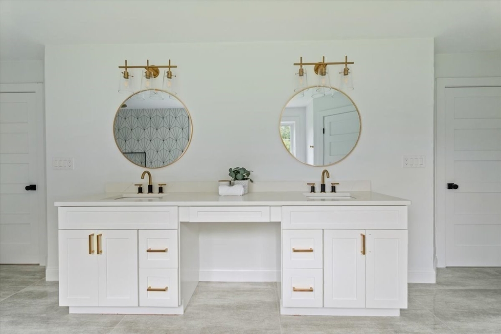 103 Center Street Hanover, MA 02339 - Photo 26 of 42 a bathroom with a sink and a mirror