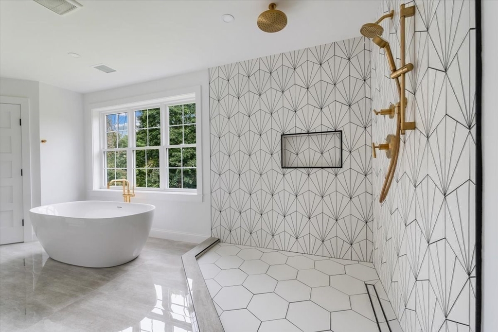 103 Center Street Hanover, MA 02339 - Photo 27 of 42 a bathroom with a bathtub and shower