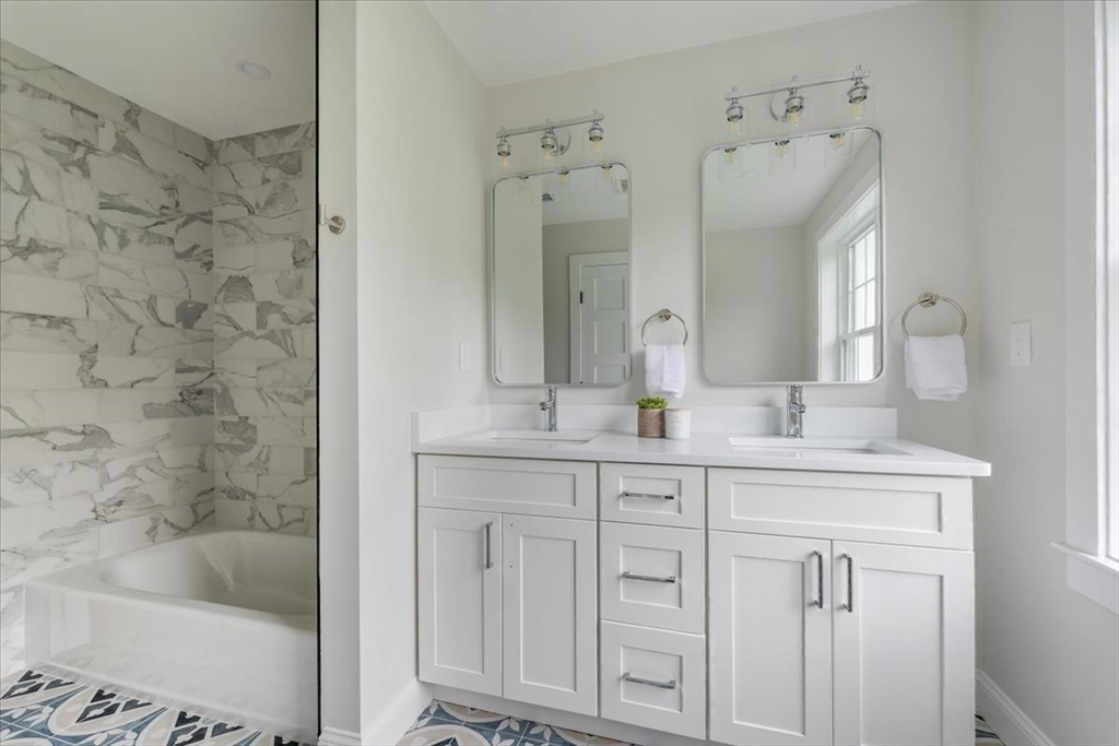 103 Center Street Hanover, MA 02339 - Photo 33 of 42 a bath room with a sink and a bathtub