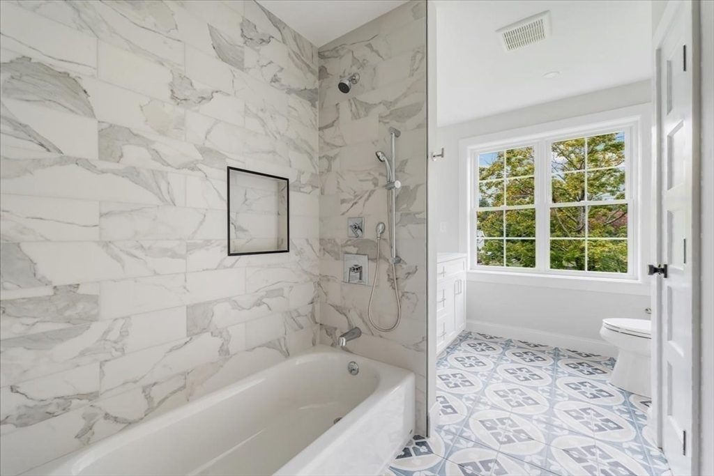103 Center Street Hanover, MA 02339 - Photo 34 of 42 a bathroom with a bathtub and a shower