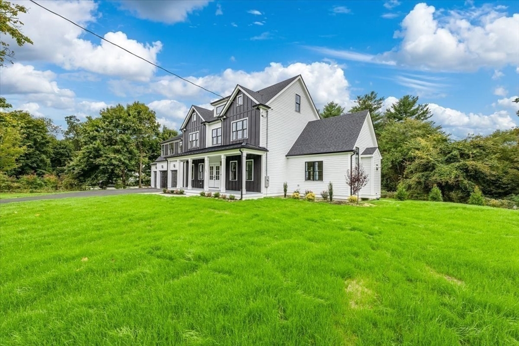 103 Center Street Hanover, MA 02339 - Photo 4 of 42 a front view of a house with a garden