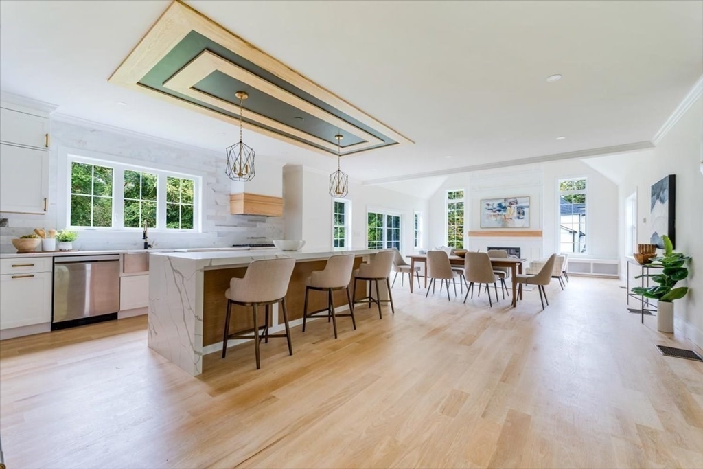 103 Center Street Hanover, MA 02339 - Photo 10 of 42 a view of a dining room with furniture and wooden floor