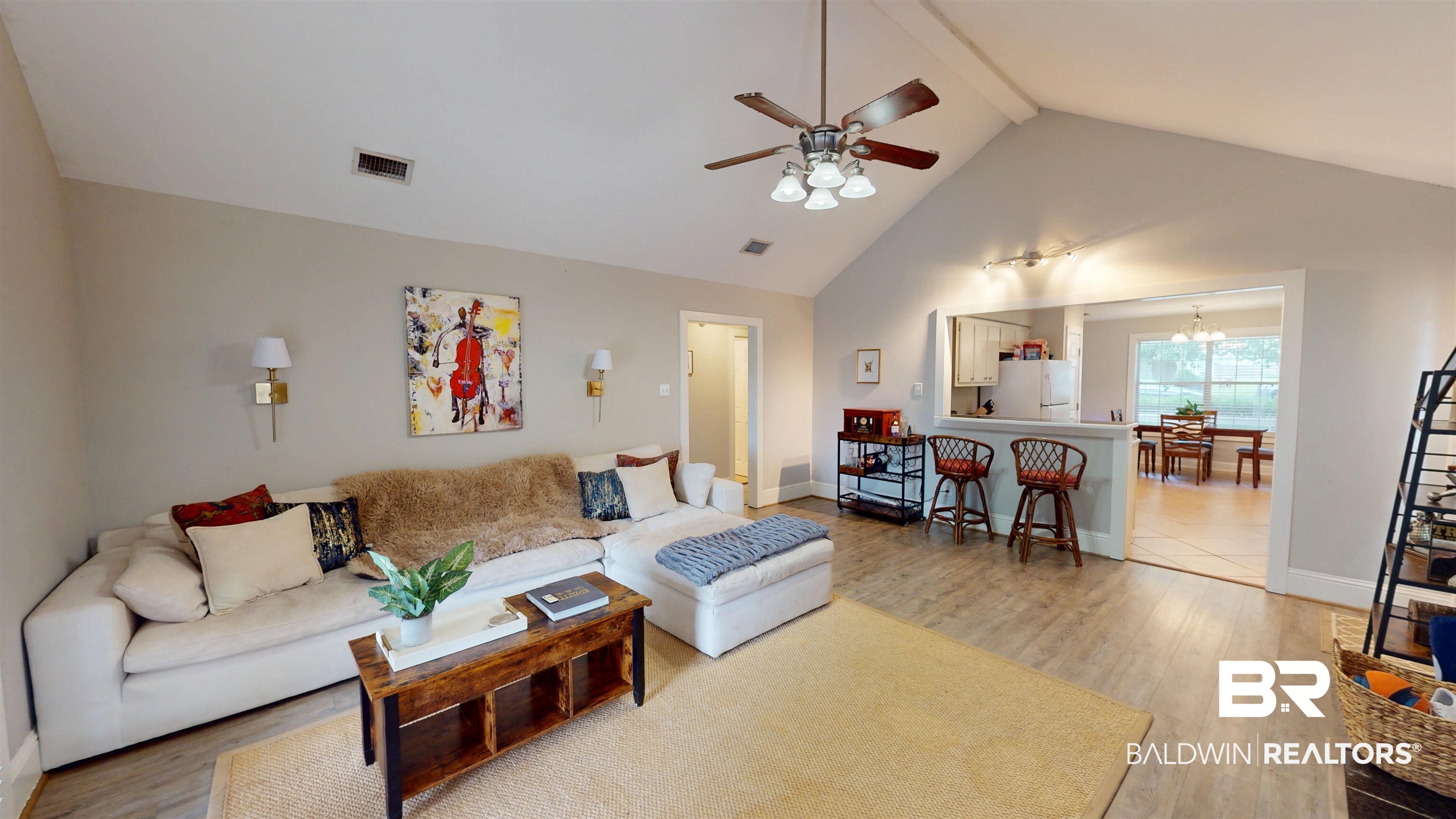 51 Bishop Lane South Mobile, AL 36608 - Photo 9 of 19 Living area featuring light wood-style flooring, high vaulted ceiling, beam ceiling, ceiling fan, and a chandelier