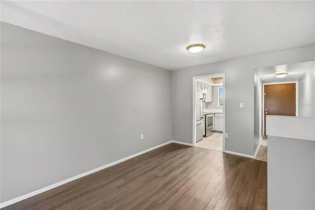 a view of wooden floor and windows in a room