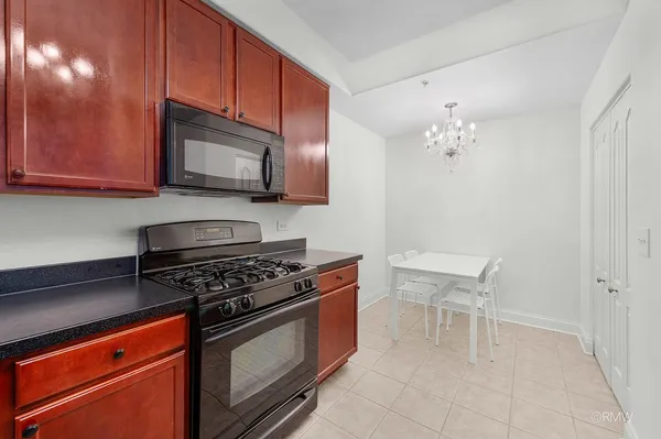 a view of a room that has a table and chair in it