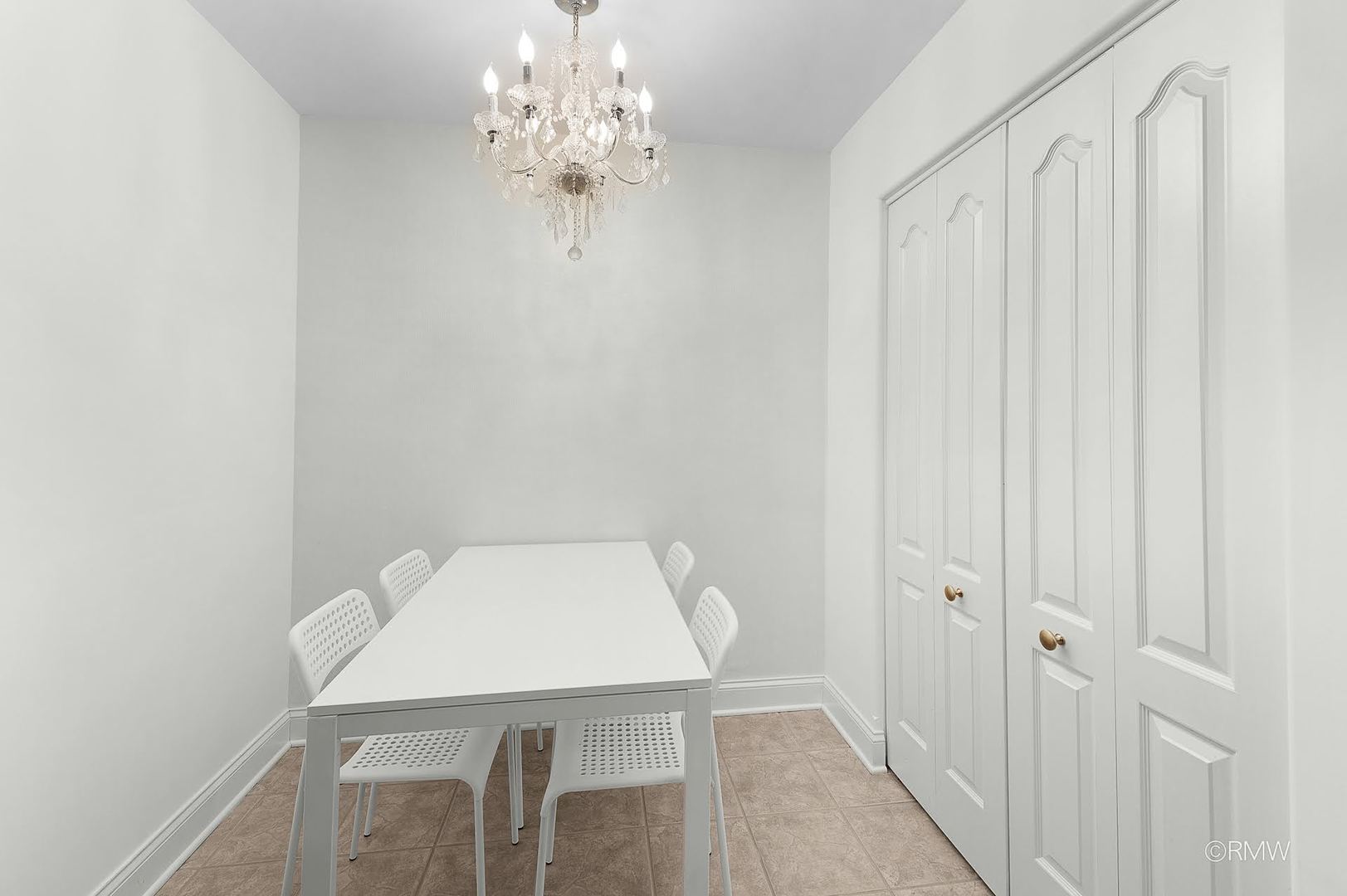 1 Itasca Place, Unit 412 Addison, IL 60143 - Photo 13 of 28 a view of a room that has a table and chair in it