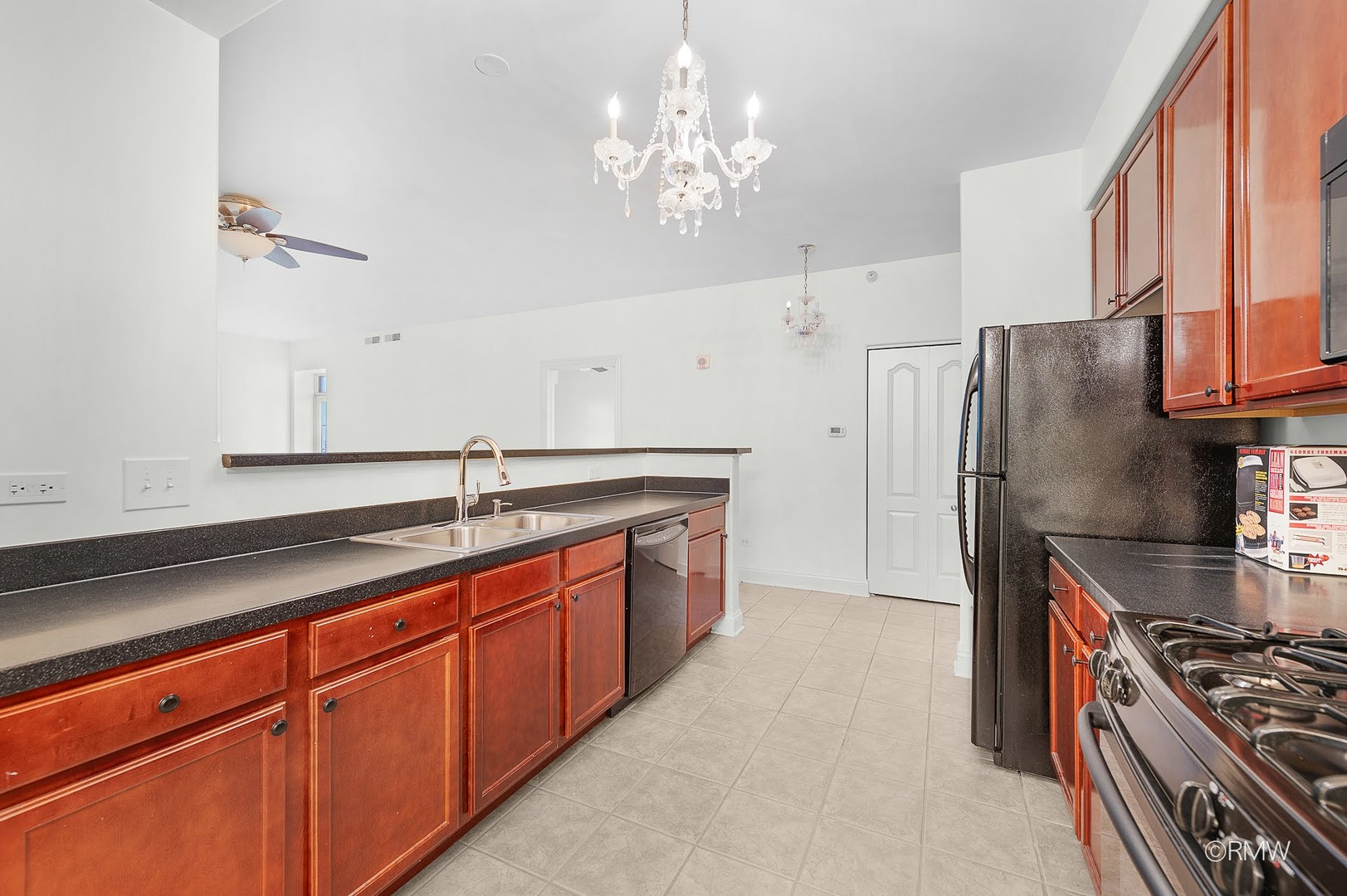 1 Itasca Place, Unit 412 Addison, IL 60143 - Photo 14 of 28 a kitchen with stainless steel appliances granite countertop a sink stove and refrigerator