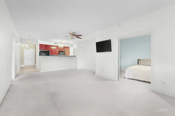 a view of empty room with windows and fireplace