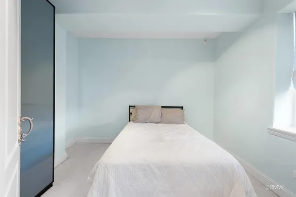a view of a kitchen with an empty space and a window
