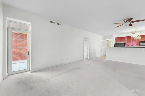 en empty room with a ceiling fan and a ceiling fan