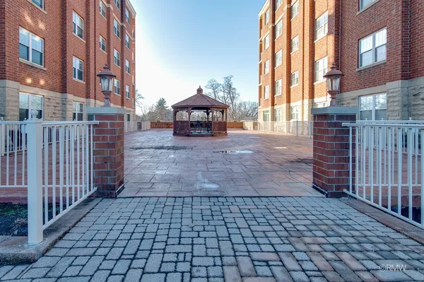 a view of a brick building with many windows