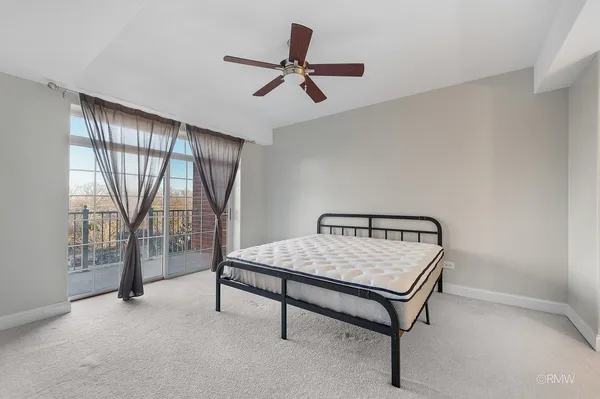a room with pool table and a ceiling fan