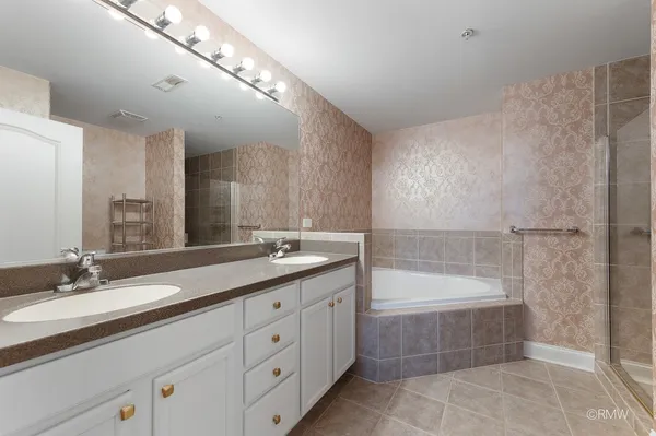 a bathroom with a bathtub and toilet