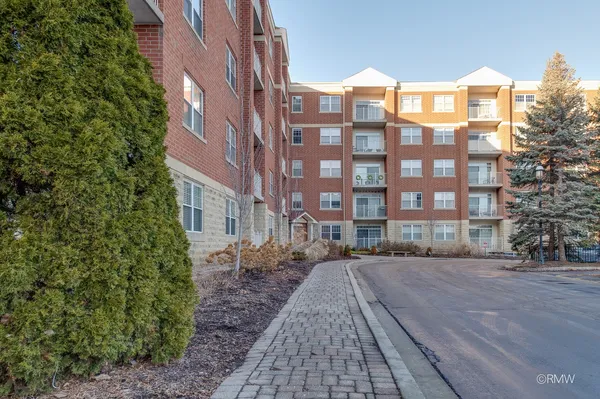 a view of a building with a yard