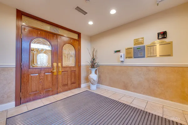 a view of a room with wooden floor and window