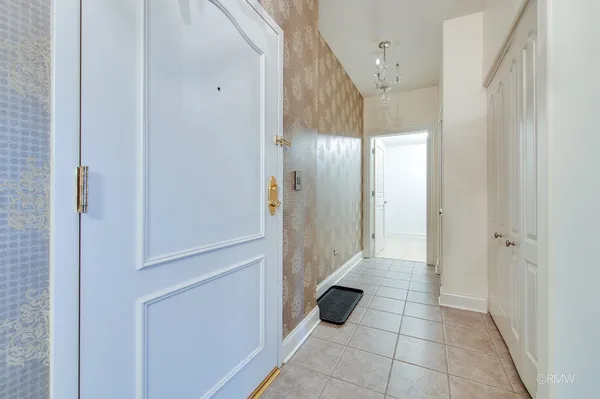 a kitchen with a refrigerator and a refrigerator