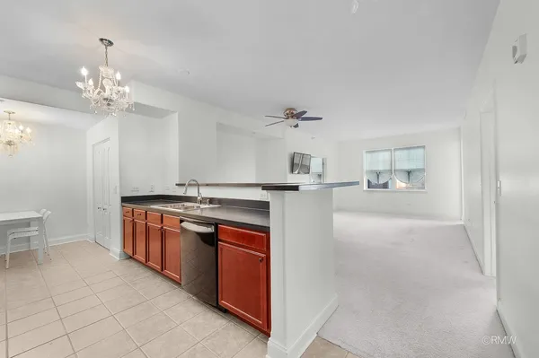 a kitchen with stainless steel appliances a sink stove and refrigerator