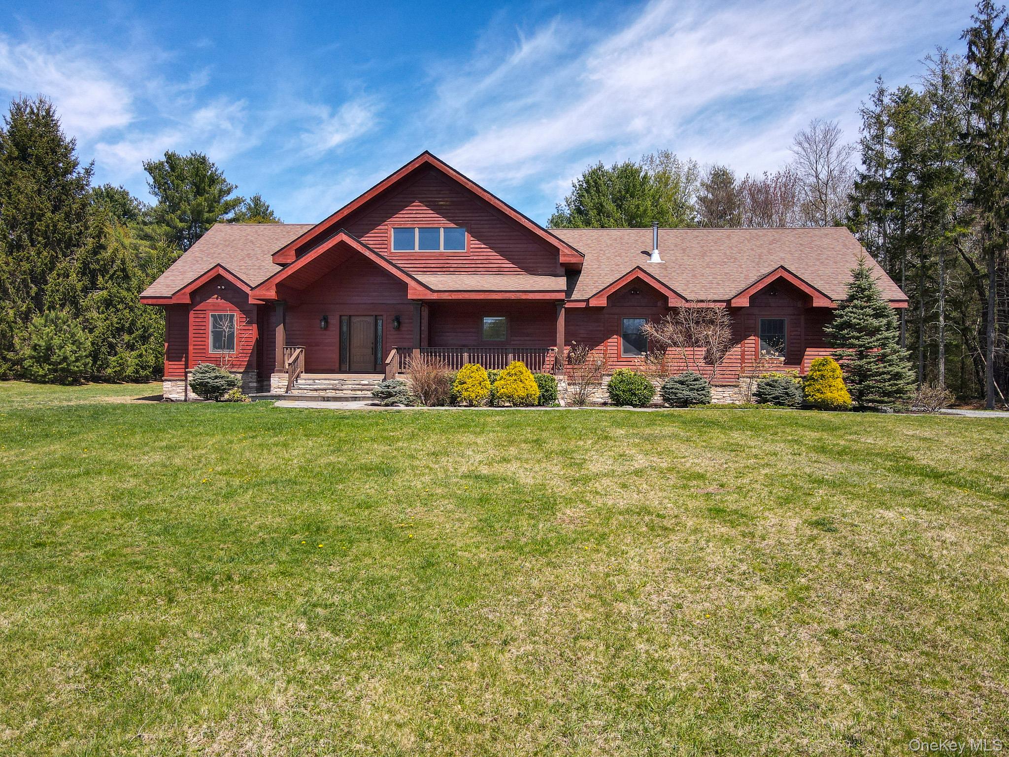 58 Deer Meadow Road White Lake, NY 12786 - Photo 2 of 41 View of front of home with covered porch, a front lawn, and a shingled roof