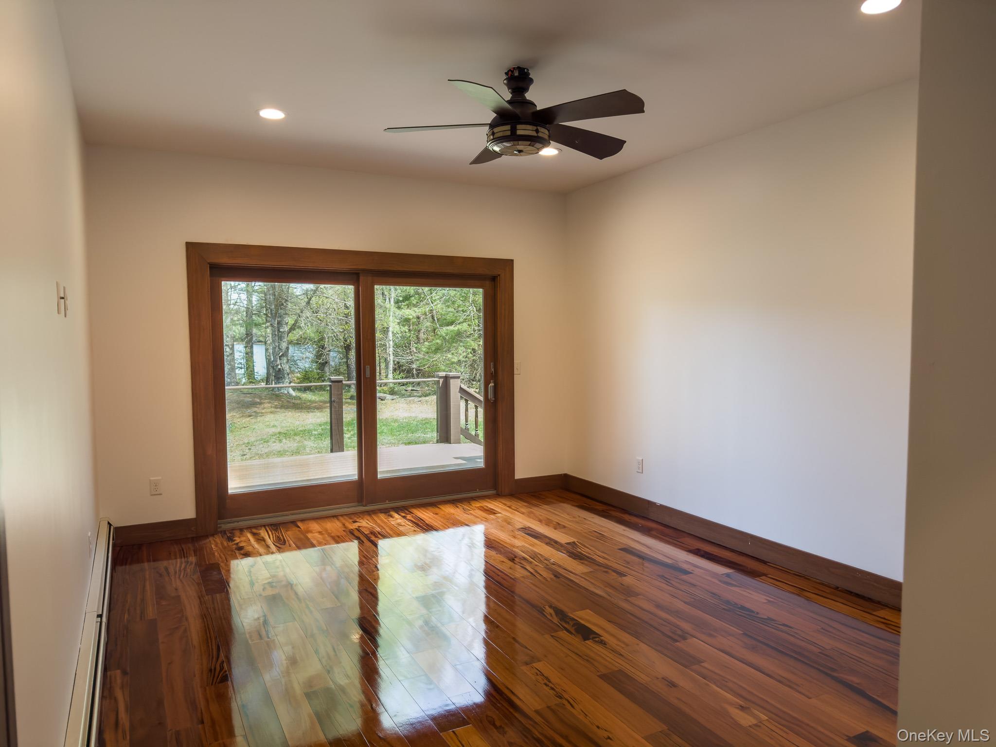 58 Deer Meadow Road White Lake, NY 12786 - Photo 23 of 41 Bedroom #2 featuring hardwood floors, a baseboard heating unit, recessed lighting, and a ceiling fan
