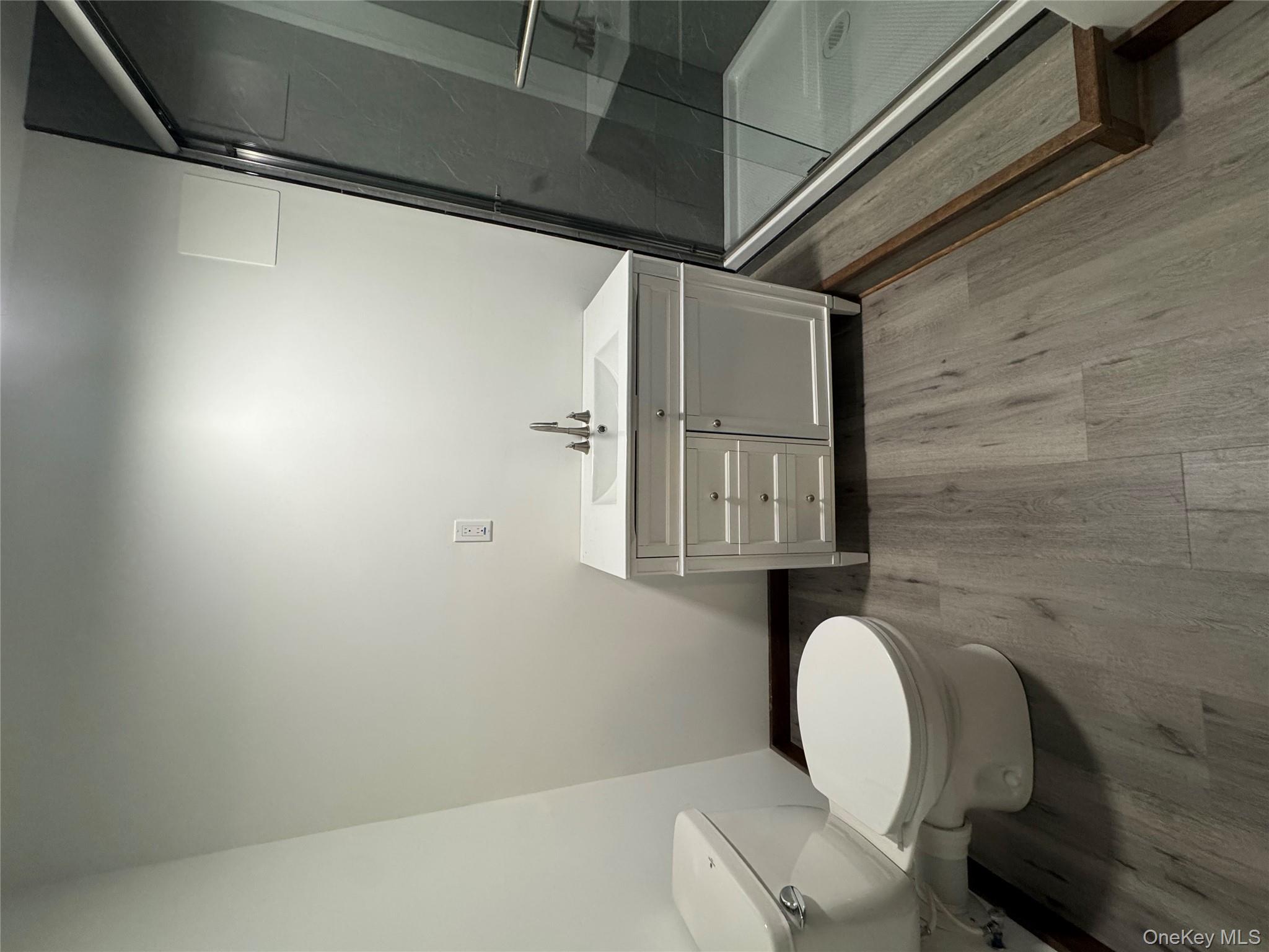 58 Deer Meadow Road White Lake, NY 12786 - Photo 30 of 41 Bathroom #3 Full bathroom featuring vanity, baseboard heating, Shower tile shower stall