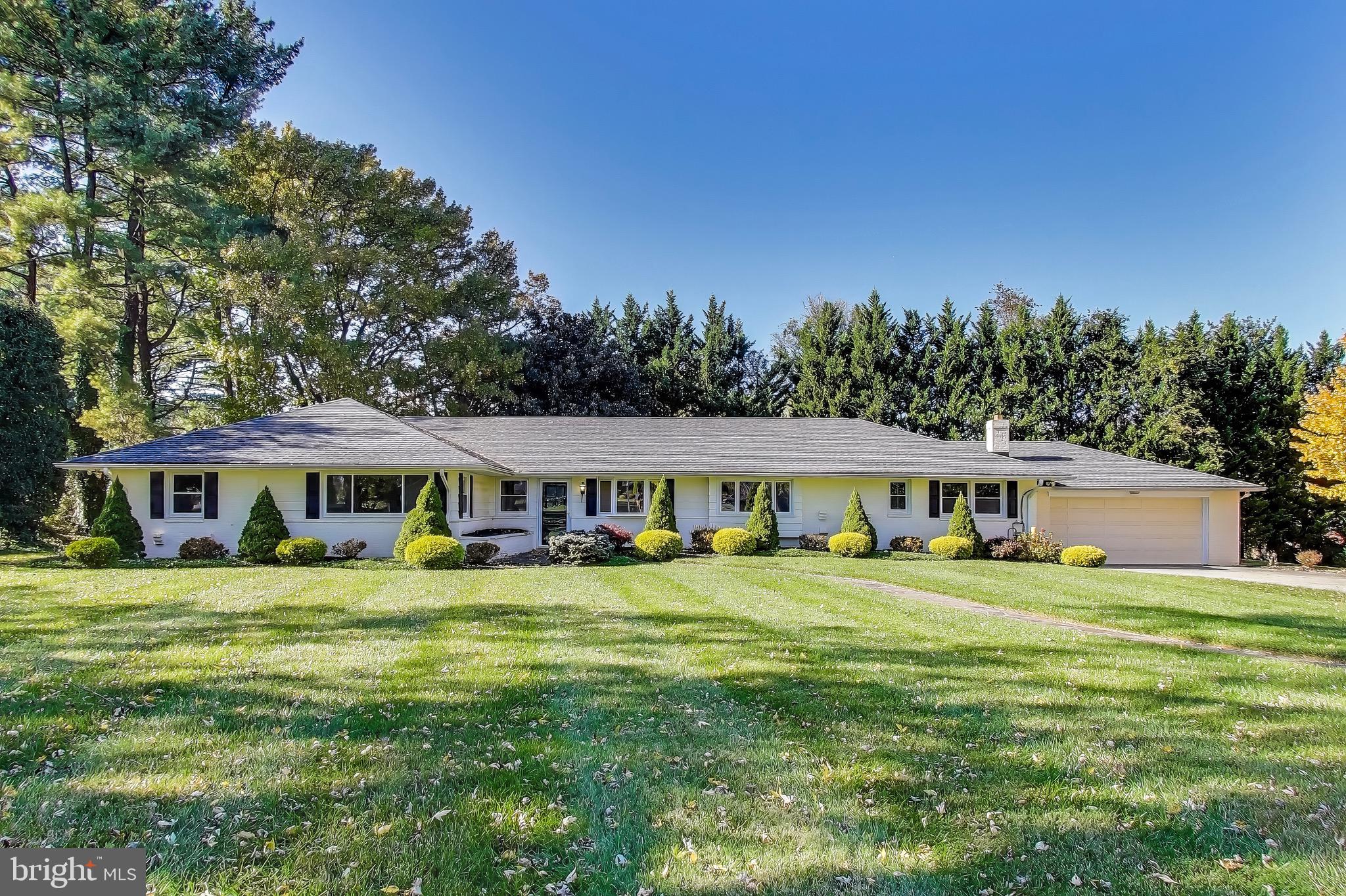 402 Ivy Church Road Lutherville-Timonium, MD 21093 - Photo 12 of 63 a front view of a house with a garden